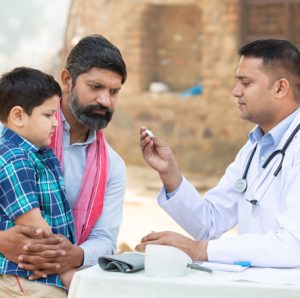 Illustration of India map with medical icons showing healthcare challenges and system gaps in India.